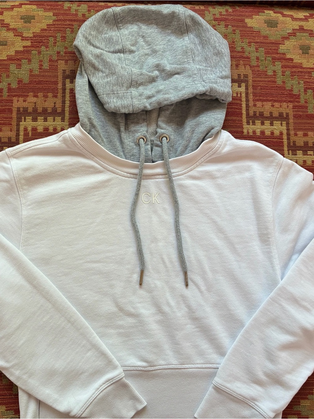 Calvin Klein White Pullover Hoodie with Gray Hood size Medium
Crop length